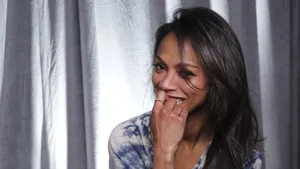 Zoe Saldana Playful And Candid Photograph Wallpaper