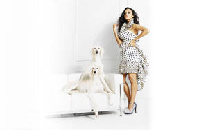 Zoe Saldana With Two White Dogs Wallpaper